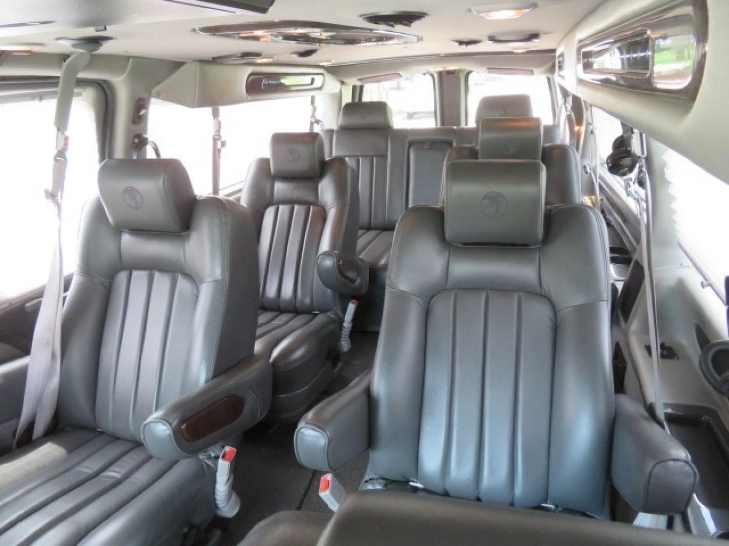 2014 Chevrolet Express (1GBWGLCG3E1) , located at 4301 Oak Circle #19, Boca Raton, FL, 33431, (954) 561-2499, 26.388861, -80.084038 - You are looking at a Rare 2014 Chevy Express 2500 Quigley 4x4 Four Wheel Drive Explorer Limited SE 9 Passenger Conversion Van with: 107K Original Miles, 6 Captain Chairs, Rear Power Folding Bench Seat Bed, Center Consoler Cooler, Front PPF (Paint Protection Film) Explorer Limited Conversion Througho - Photo#78